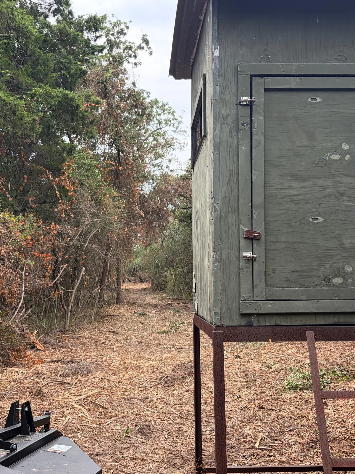 A hunting blind beside an access lane