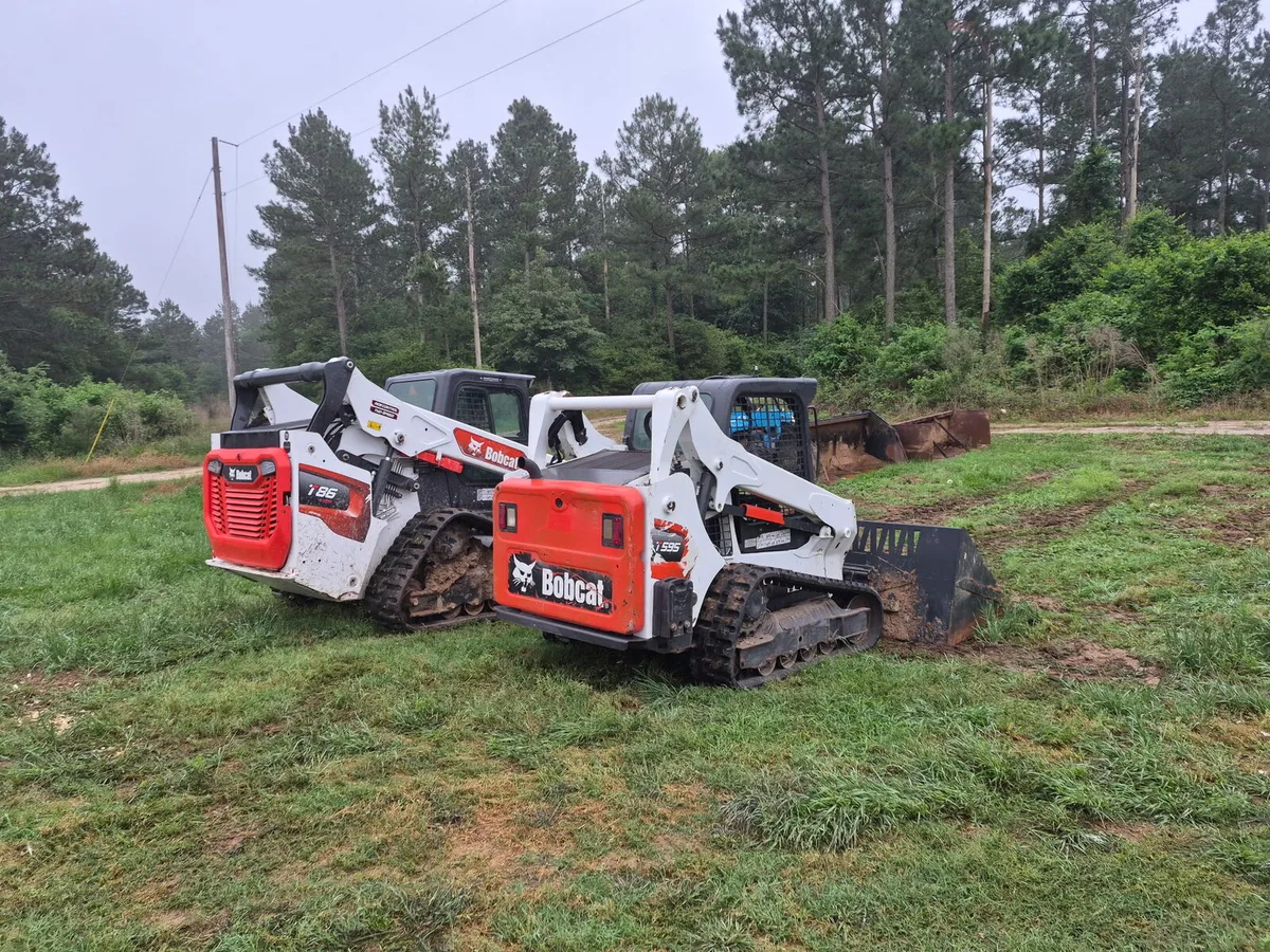 Two BnB track loaders on the ground